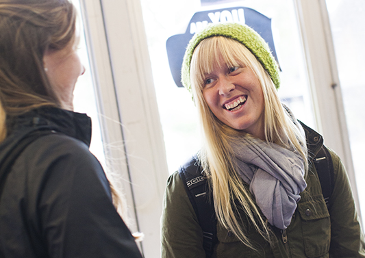 Students converse in the Seymour Hall gallery. 