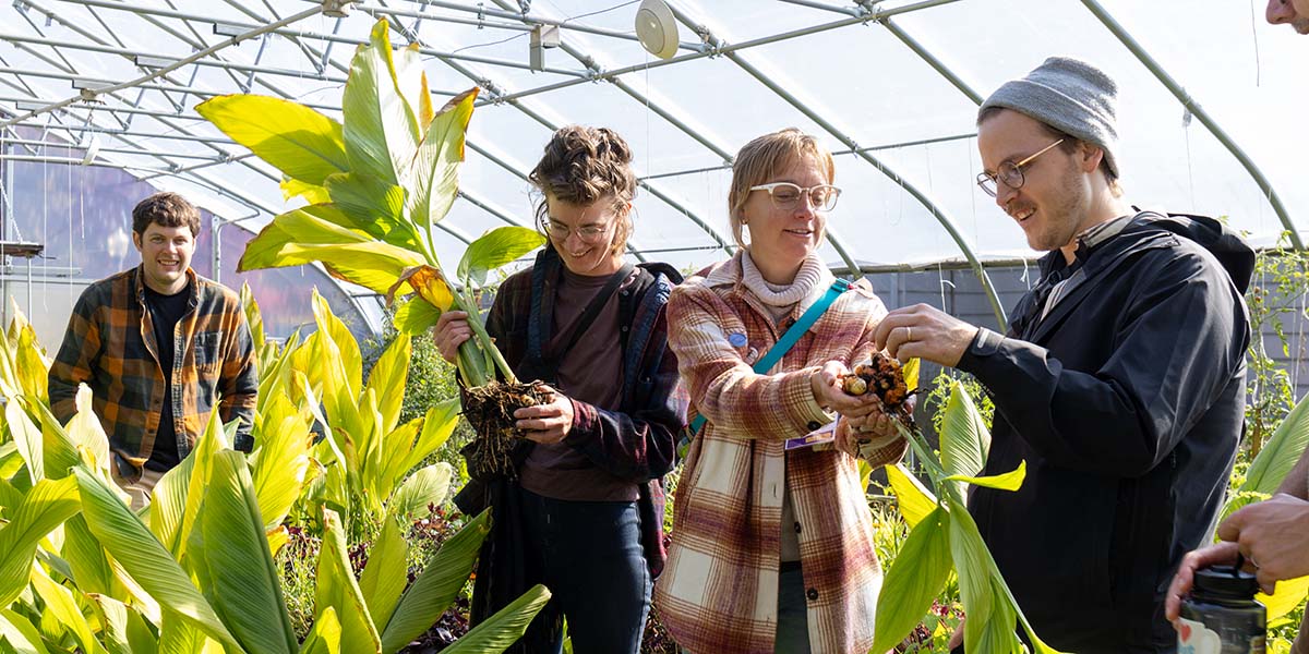 Alums work in the Knox Farm during Homecoming.