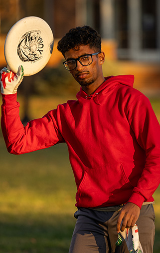 A student practicing for ultimate frisbee.