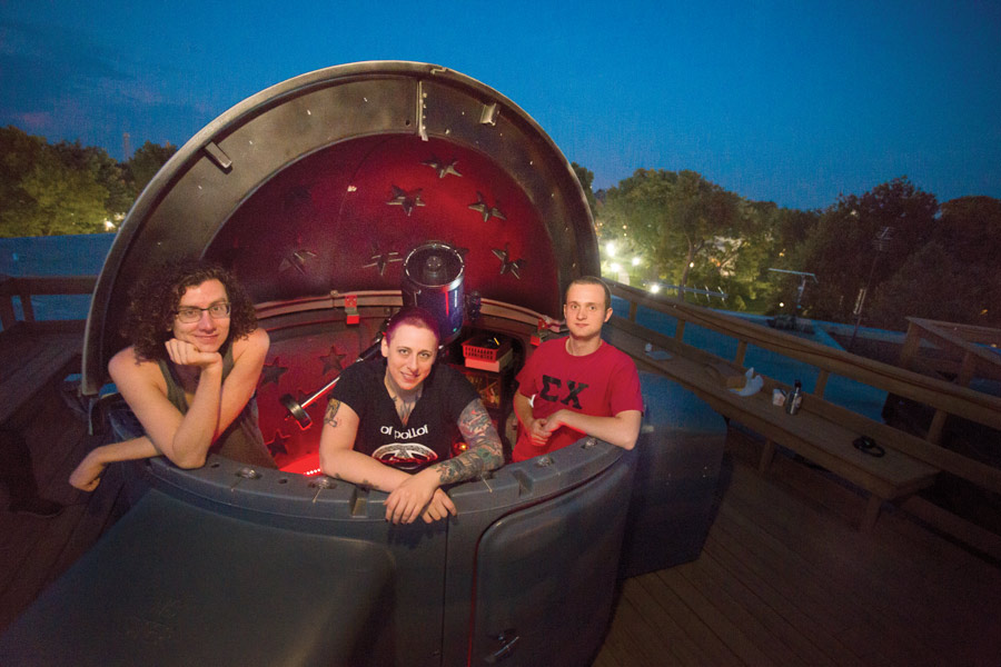 Students pose in the telescope atop the SMC