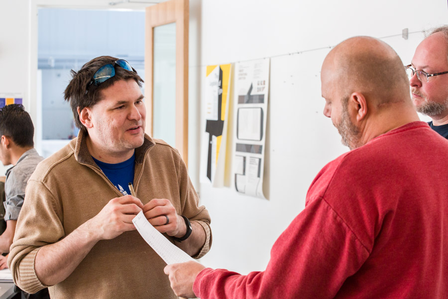 Jaime Spacco (left), Tim Stedman (right middle), and Craig Choma (far right) discussing class