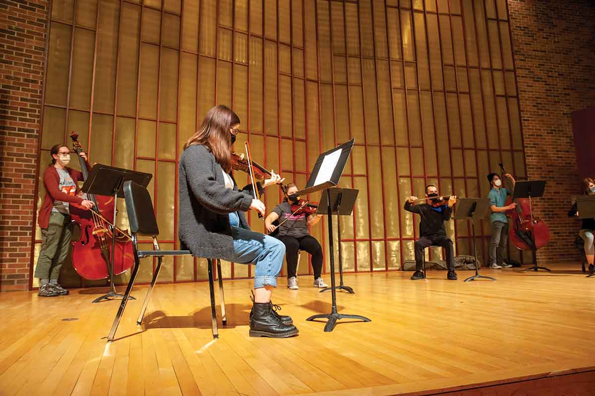 Members of the Knox String Ensemble conduct a socially distanced rehearsal.