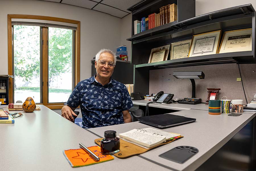 Julio Noriega at his desk