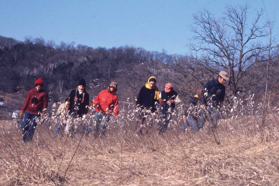 Participants of Farm Term walk the fields during a morning class.