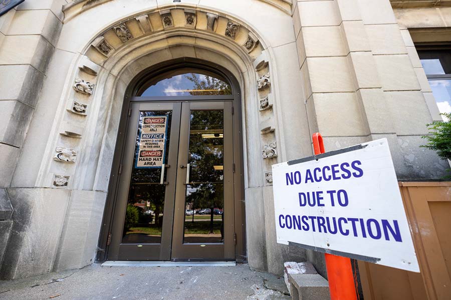 The front doors of George Davis Hall with a sign outside that reads No Access Due to Construction.