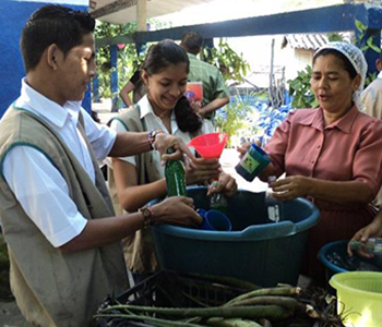 Students learn to bottle their recently-made shampoo