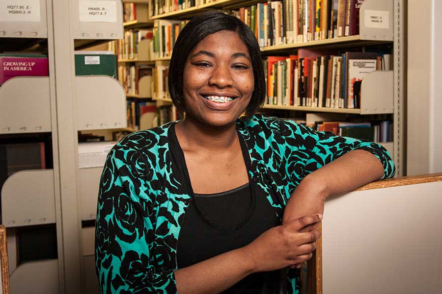 Knox College student Chelsea Bennett '16 poses in Seymour Library.