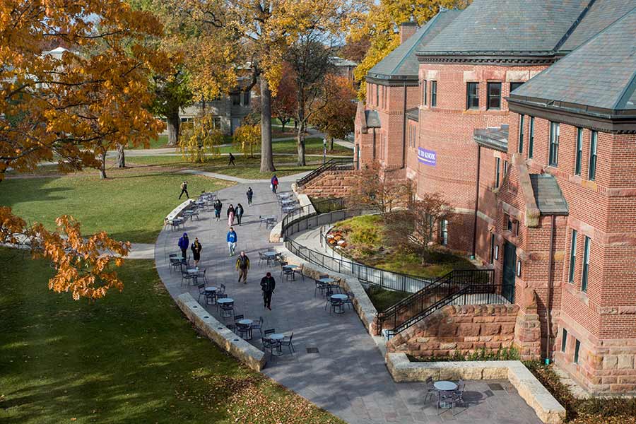 Student outside Alumni Hall at 