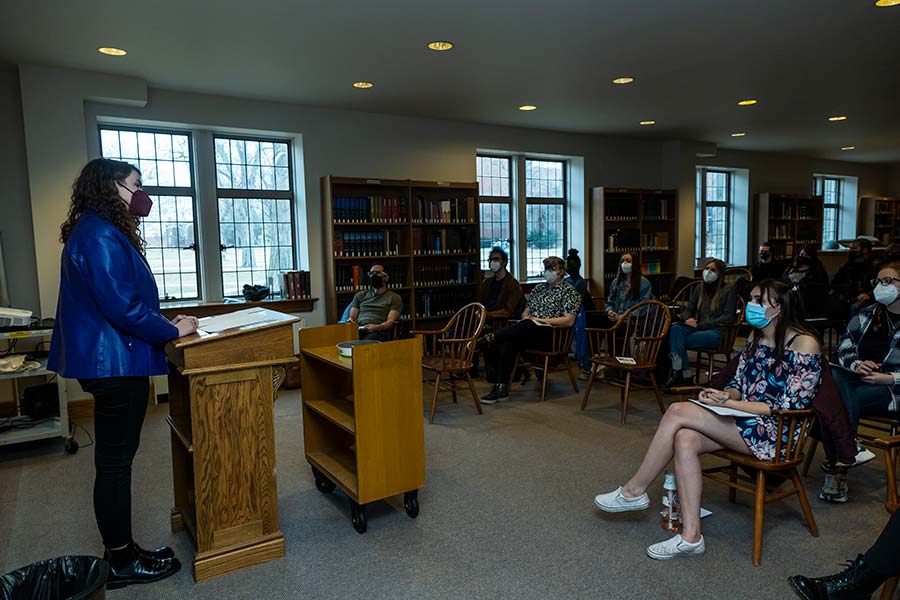 Molly Cyr reads to her peers and Knox faculty members while friends and family listen on Zoom.