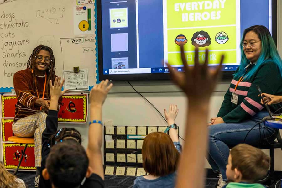 Knox students present stories in Chinese to a local classroom.