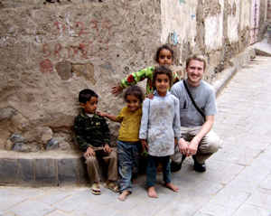 Devin surrounded by Yemeni children in the Suq market area of old Sana'a.