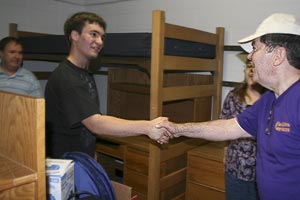 Roger Taylor greets student and family