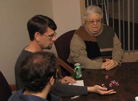 Students play board games with senior citizens