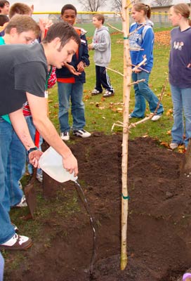 Dan Prieto and students plant tree