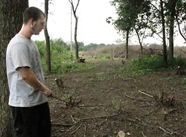 Eric Ballard examines a newly cleared area