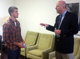 John J. Hanlon talks with student