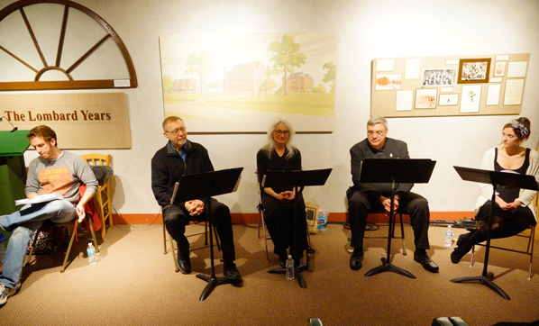 Steve Selwa '13 leads Nicole Hughes '15 and Galesburg residents through a reader's theatre called "The World of Carl Sandburg"