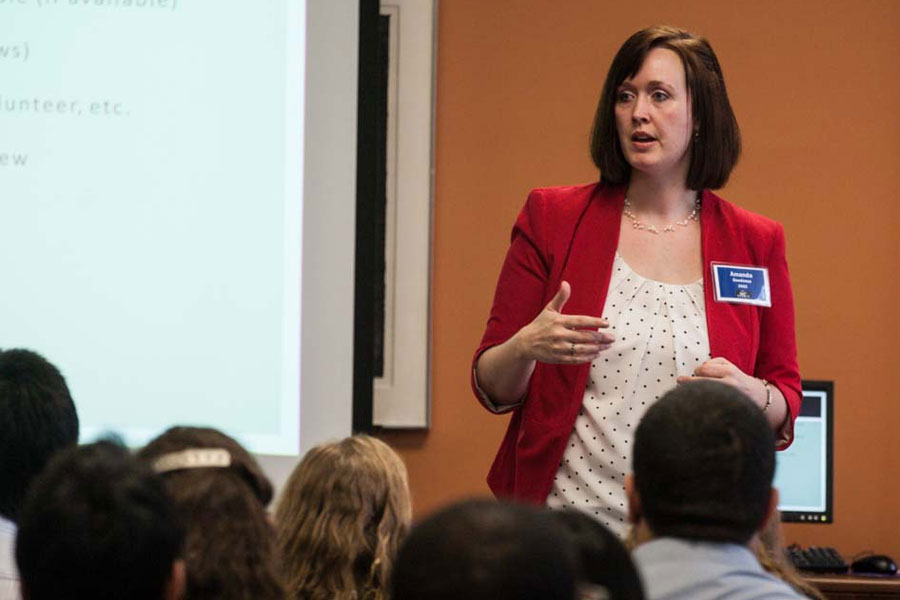 Students get pointers from alumni about writing resumes and searching for jobs.