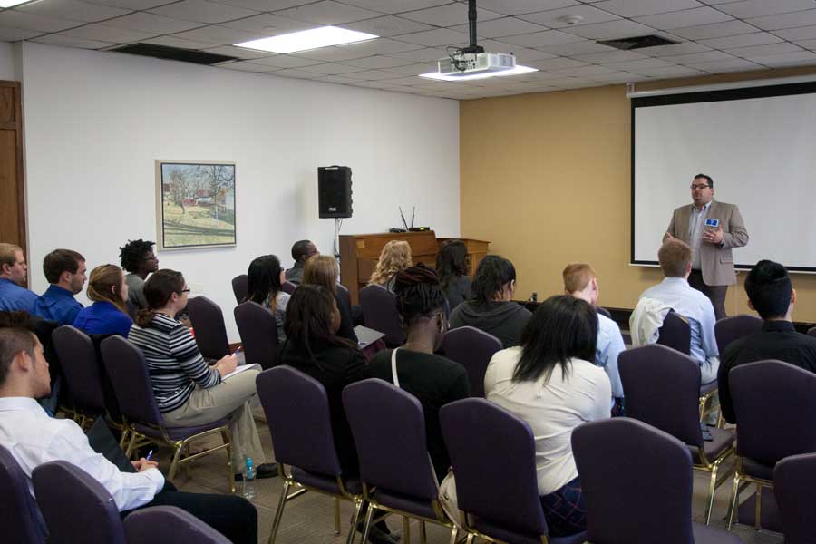 Students listen to a presentation given by Greg Lardi '02 during Knox College's 2014 Career Impact Summit. 