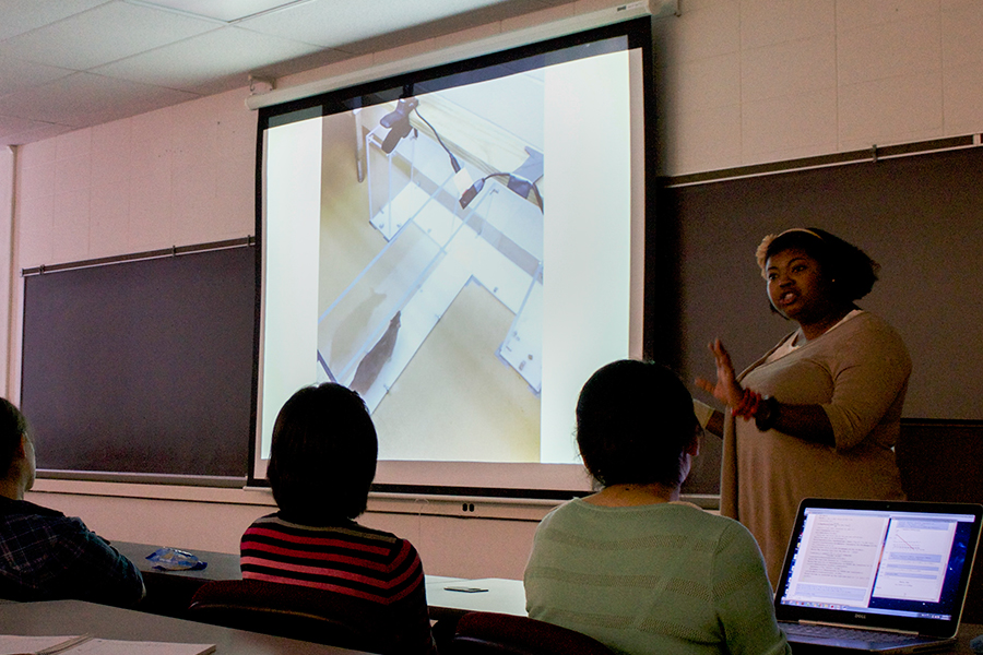 Danielle Lee addresses Knox College students in a lecture that explores her research on giant rats, her use of Twitter, and even her scientific study of hip-hop music.