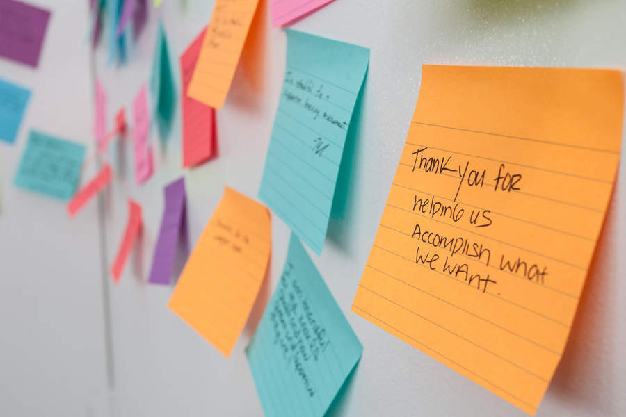 Colored sticky notes, written by students and posted on a big board in Seymour Union Gallery, thanking donors for support, during Donor Thank You Days 2015.