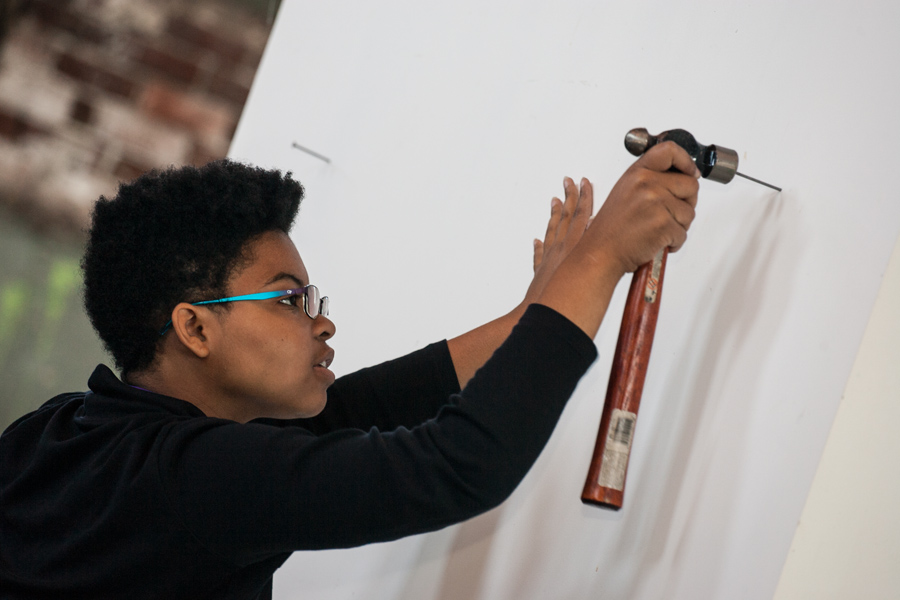 Knox College student doing volunteer work at the Galesburg Civic Art Center.