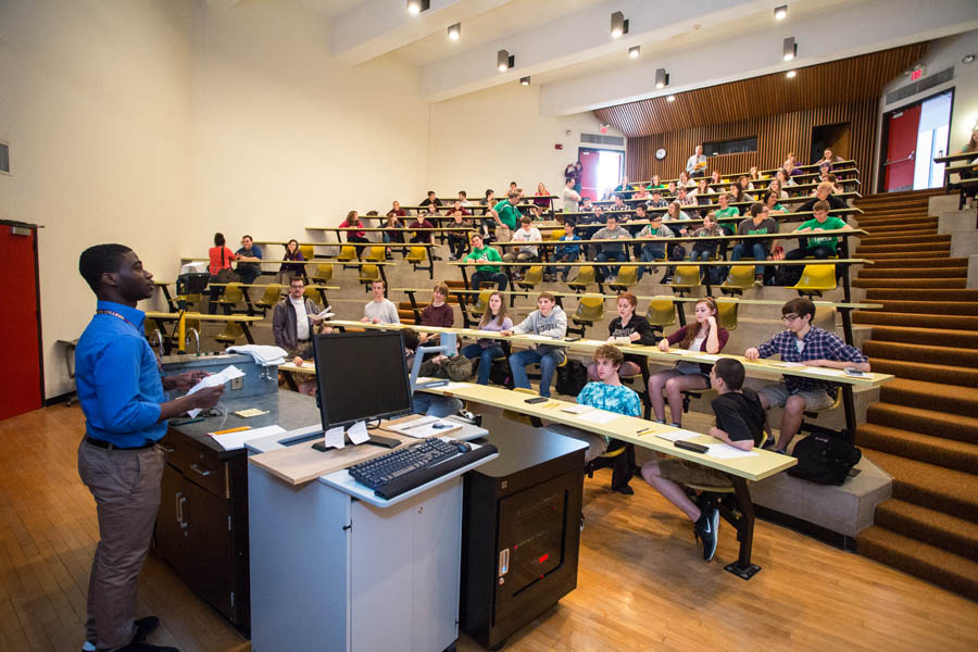 A Knox College student administers an exam to students from area high schools at the Knox College Sectional of the 2015 WYSE competition.