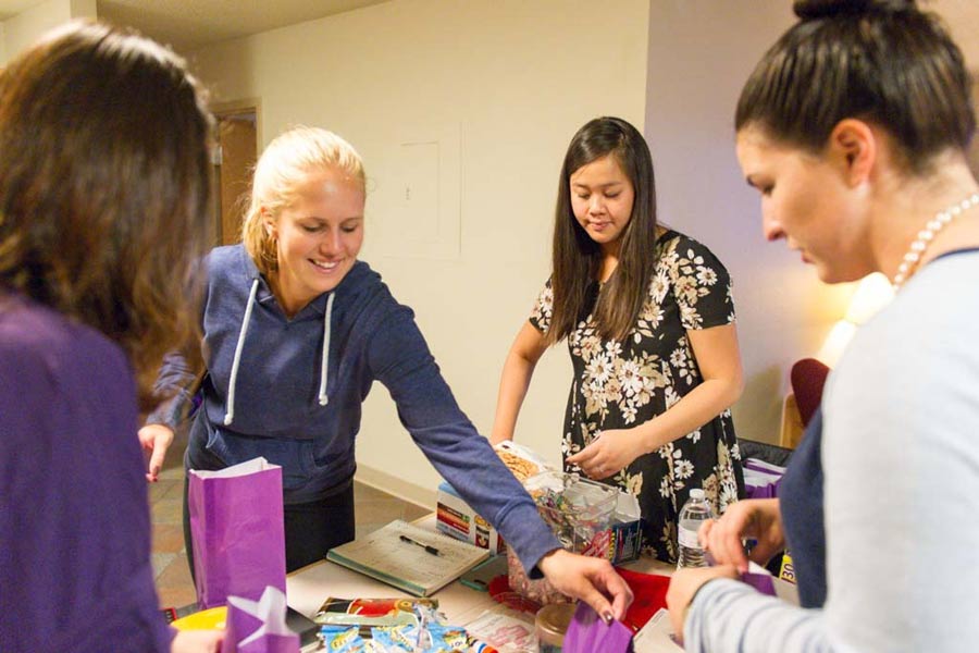 Students from the Entrepreneurship class prepare packages for sale