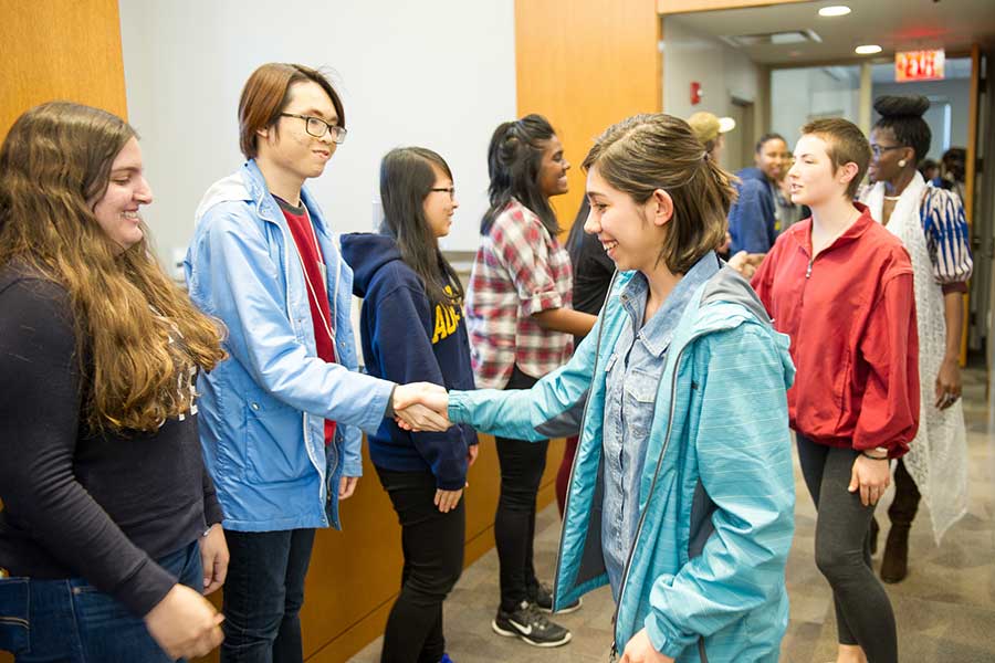 Knox and Augustana participate in a pumphandle to conclude the 2016 Global Learning Retreat