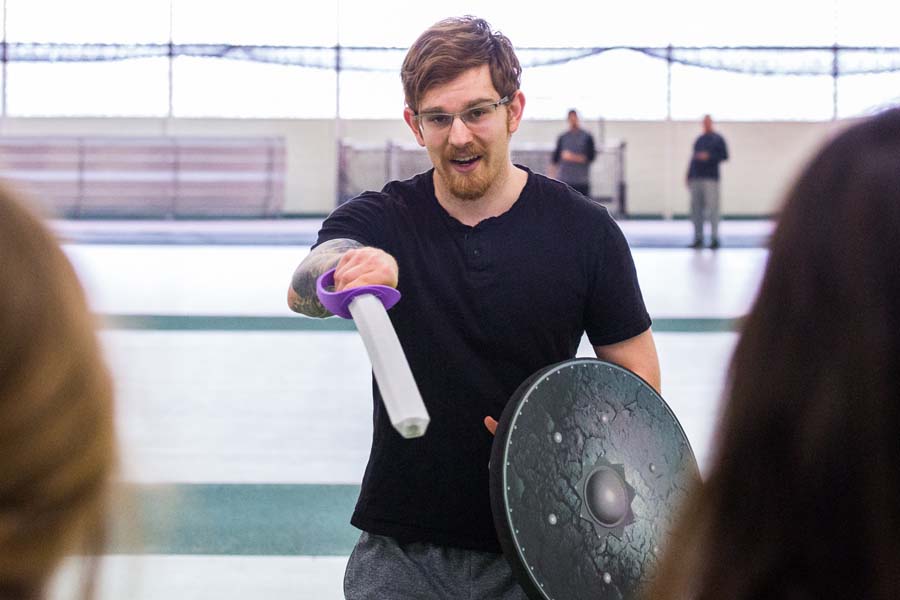 Knox College student Tim Berner leads a workshop in types of warfare in ancient history.