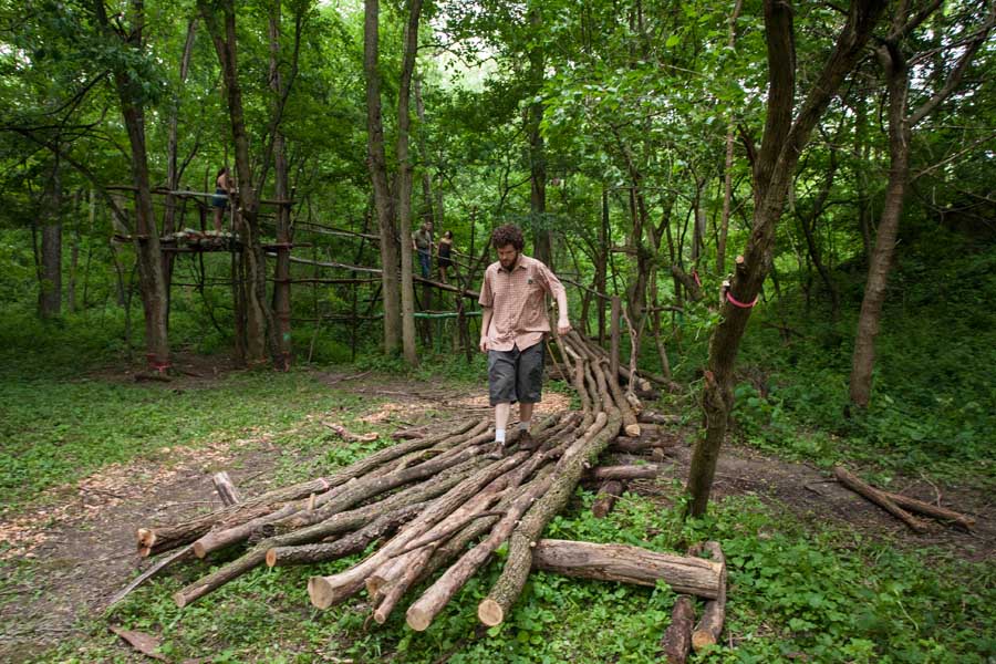 Students explore a faculty member's art project at Green Oaks.