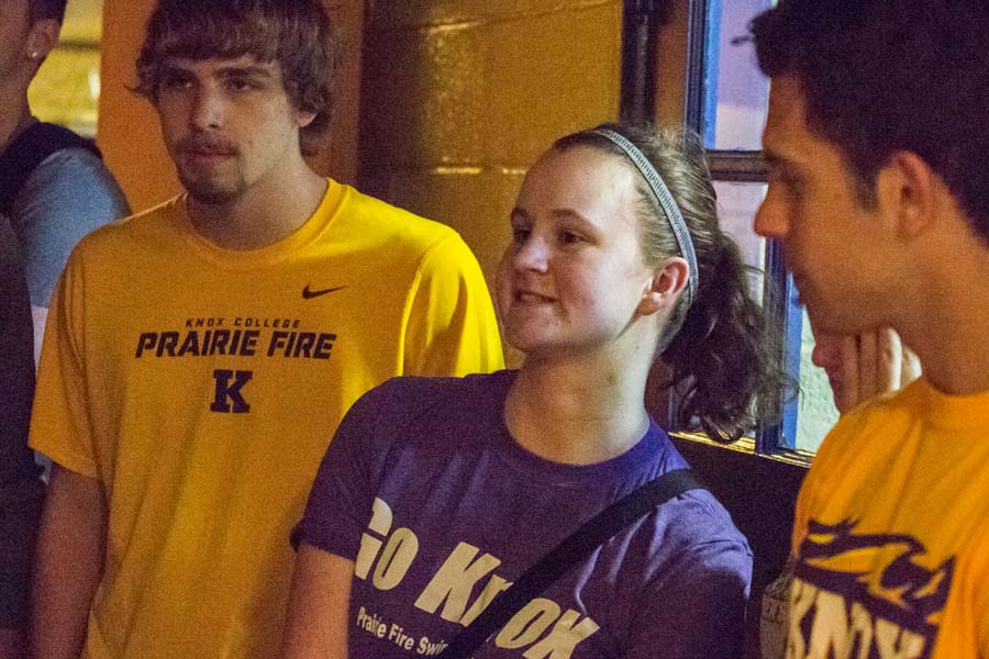 Knox College student Julia Steen helping deliver books and recreational items to the Boys and Girls Club of Knox County.