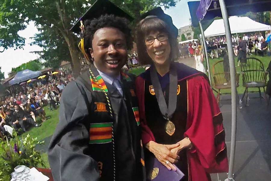 Cortney Hill '17 and President Amott take a selfie at graduation.