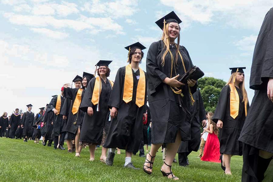 Class of 2017 graduates smile during Commencement.