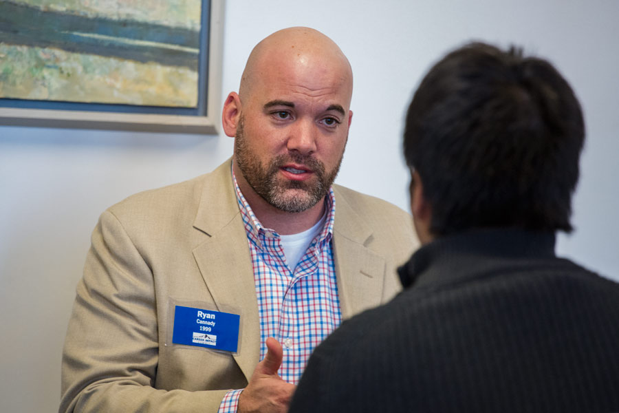 Ryan Cannady '99 speaks to a student at the Career Impact Summit