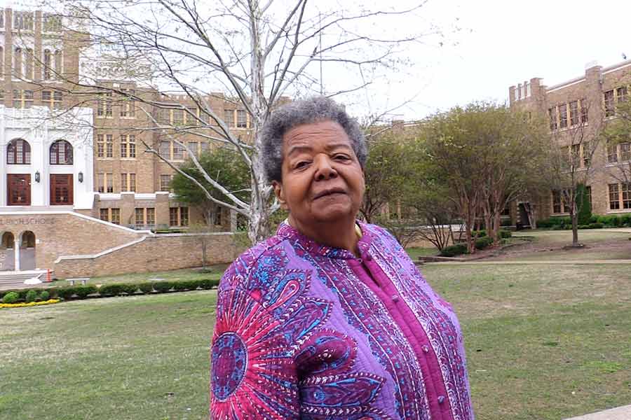 Elizabeth Eckford in front of Central High School in Little Rock, Arkansas.