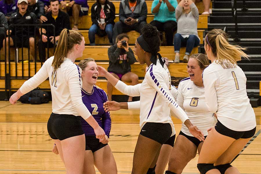 Prairie Fire volleyball celebrates.