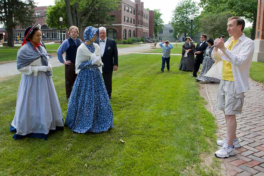 Knox College student Eric Newnham '10 gives actors direction during the filming of the movie he wrote.