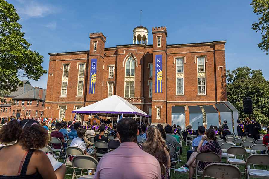 An audience sits on the South Lawn of Old Main to watch Opening Convocation