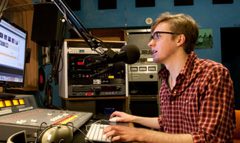 Christopher Poore '14 in the WVKC studio.