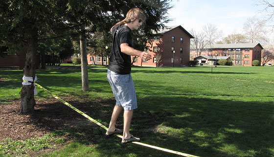 Student practices slack line.