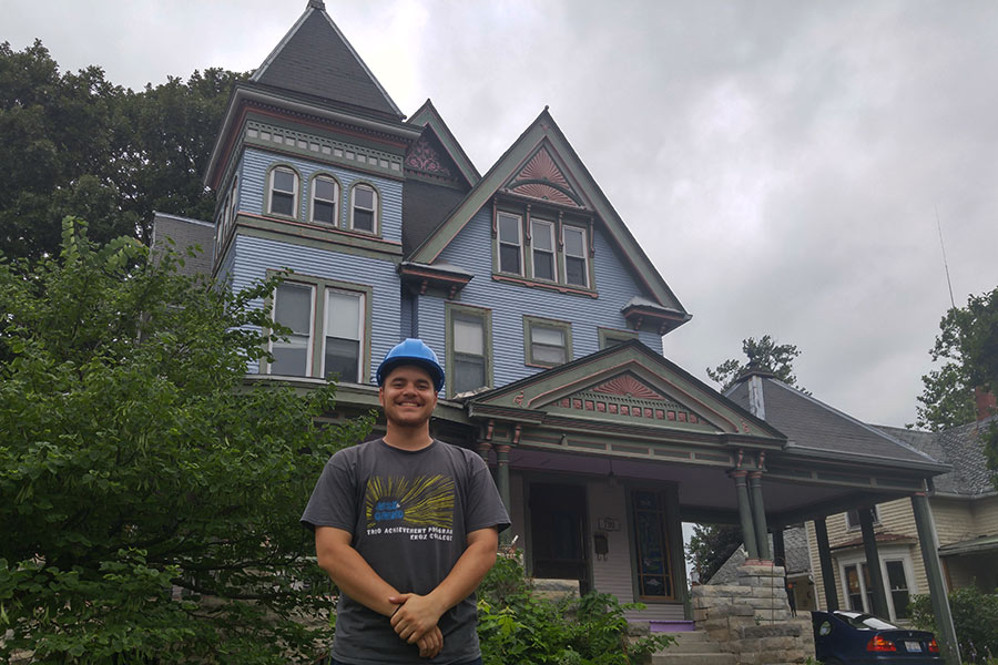 Alex Contreras with one of the houses he helped repaint. 