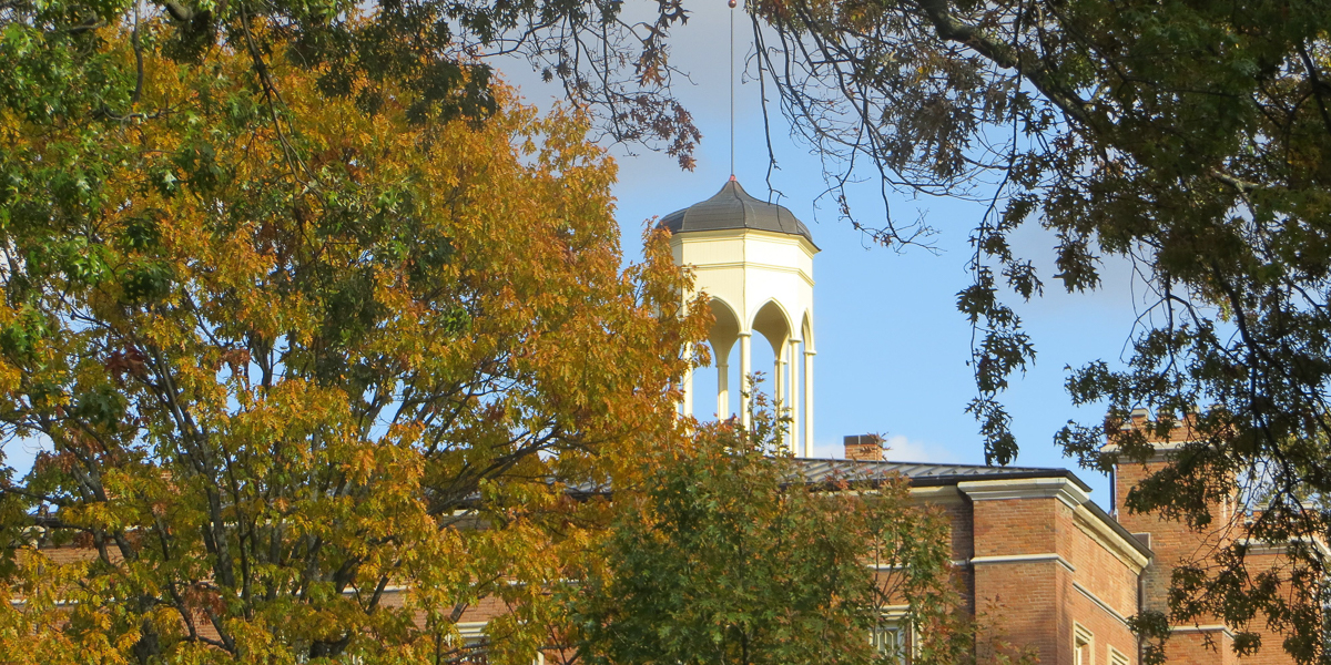 Old Main seen through trees. 