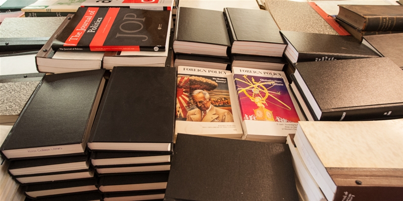 Stacks of library books inside Seymour Library. 