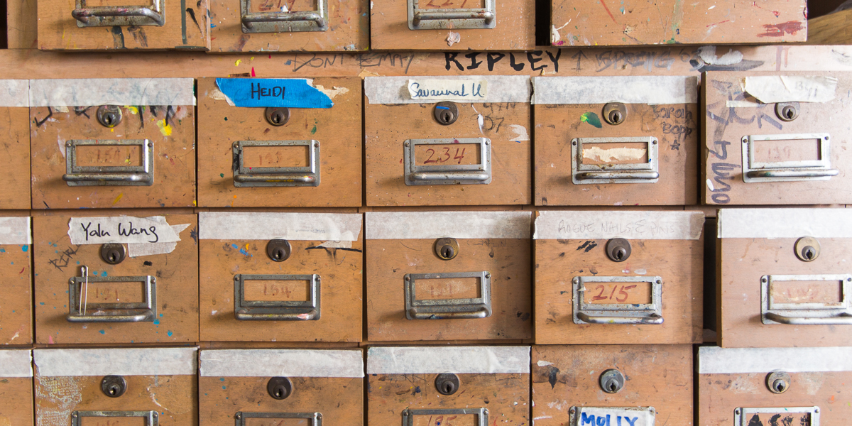 Drawers hold art supplies for students in a painting class.