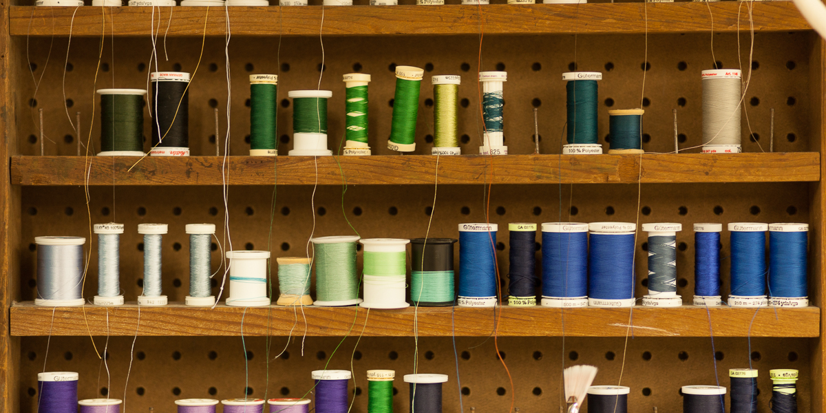 Spindles of thread inside the Knox Costume Shop.