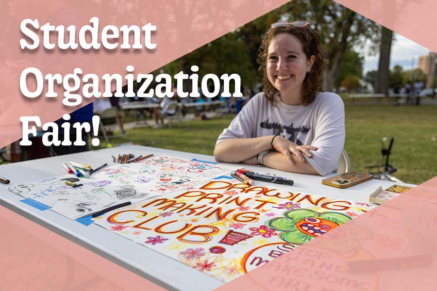 student sitting at a table outdoors; text on image reads, "Student Organization Fair!"